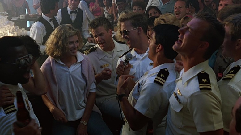 Tom Cruise as Pete "Maverick" Mitchell serenades Kelly McGillis as Charlie Blackwood in Top Gun