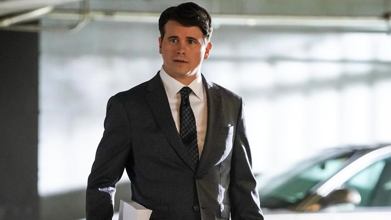 Jason Ritter as Julian walking through a car park on Matlock