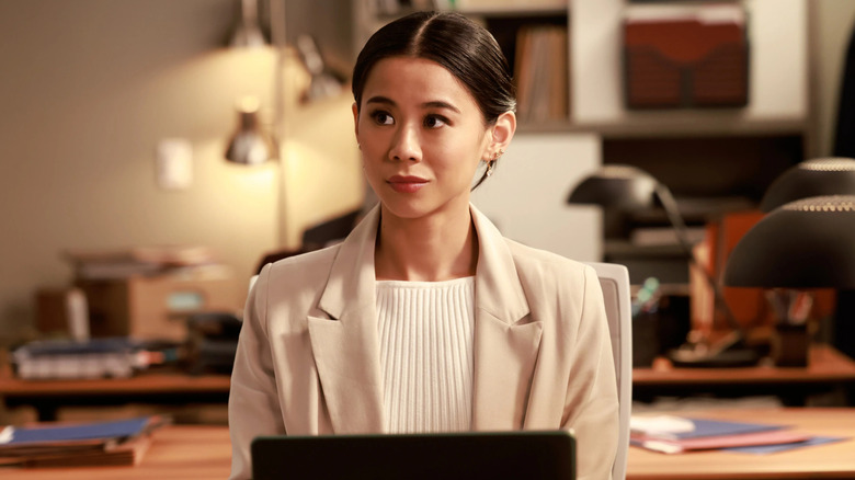 Leah Lewis as Sarah working on a laptop on Matlock