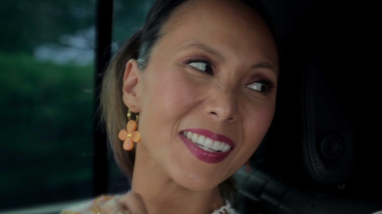 Emily Borromeo as Astrid, smiling over her shoulder on SIrens