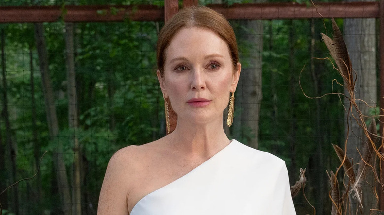 Julianne Moore as Micaela Kell, standing in her forest on Sirens
