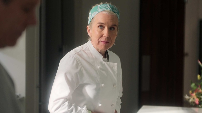 Lauren Weedman as Patrice, talking to someone in her kitchen on Sirens