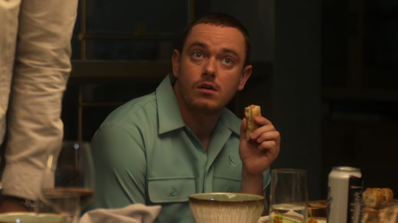 Patrick Voss Davis as Eddy, holding a piece of bread on Sirens
