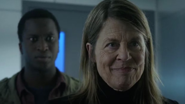 McCallister smiles proudly while David looks on shocked in Resident Alien
