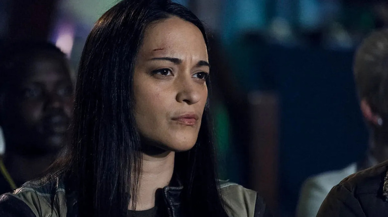 Asta stares inquisitively with a cut on her head in Resident Alien