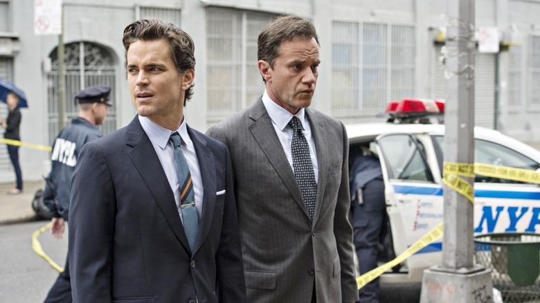 Neal and Peter approaching a crime scene in White Collar