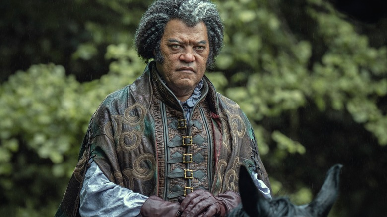 Laurence Fishburne's Regis observes Geralt and his crew in The Witcher