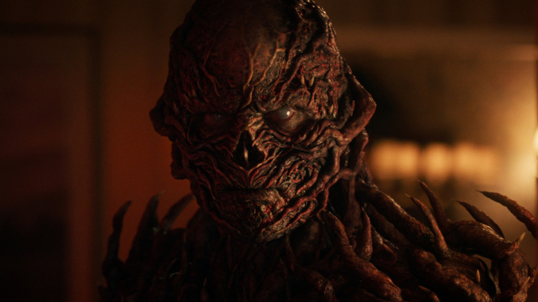 Vecna standing in a dimly-lit room in Stranger Things