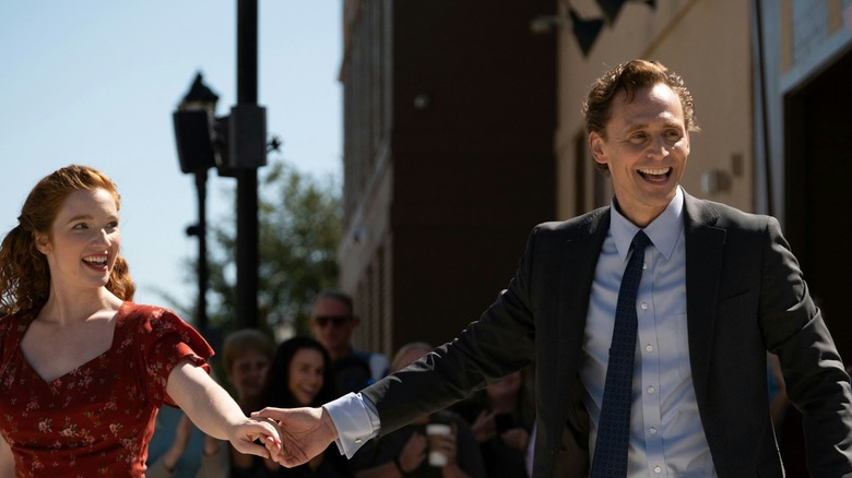 Analiz Basso in the role of Janet his hands with Tom Hedelston in the role of Charles while dancing in the street in Chuck's life