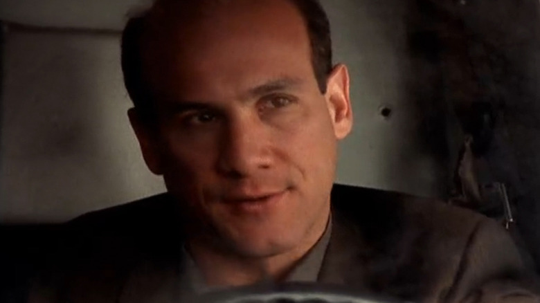 Paul Ben-Victor's Robert Albert Hobbes is seen in closeup as he drives a truck in The Invisible Man