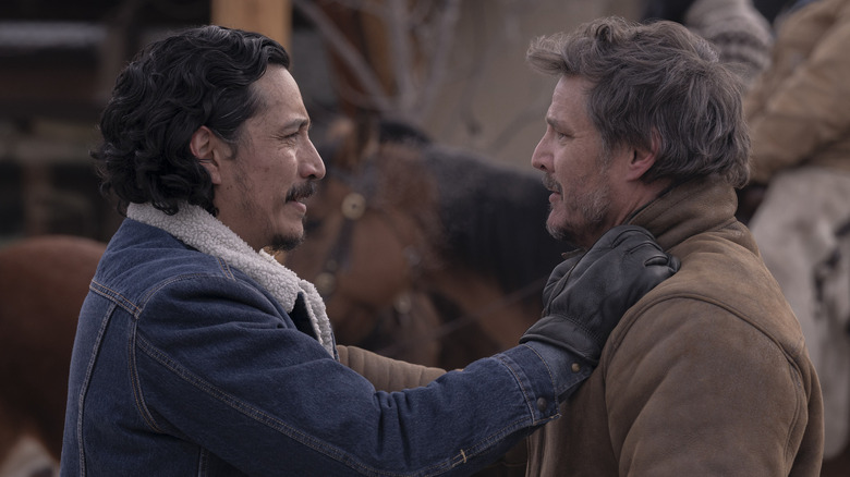 Gabriel Luna's Tommy and Pedro Pascal's Joel embracing on The Last of Us