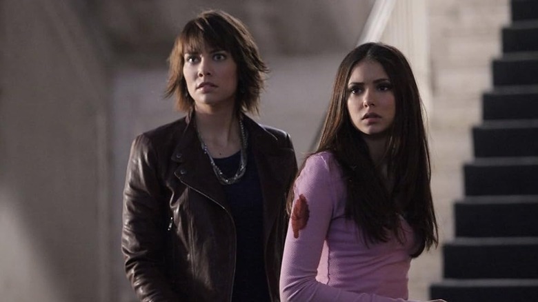 Lauren Cohan as Rose standing next to Nina Dobrev's Elena in The Vampire Diaries episode Rose