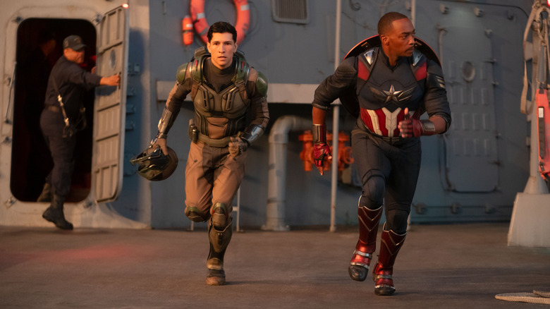 Danny Ramirez as Joaquín Torres/Falcon and Anthony Mackie as Sam Wilson running into action in Captain America: Brave New World
