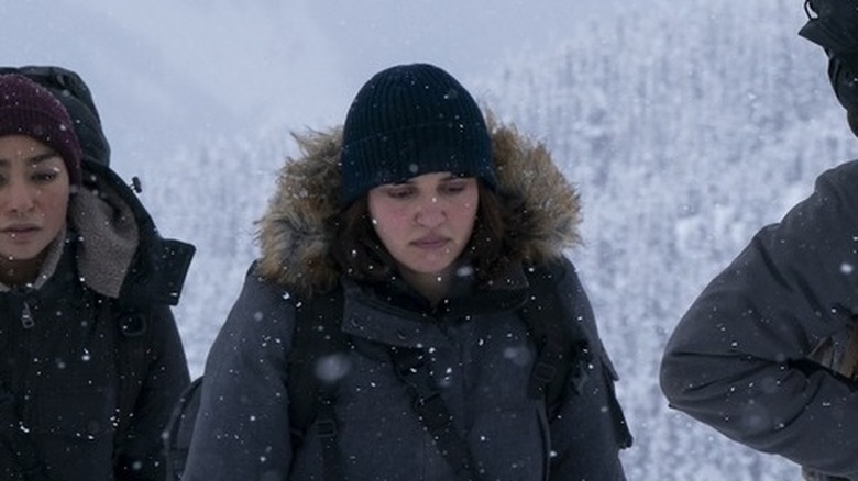 Ariela Barer's Mel walking in the snow on The Last of Us