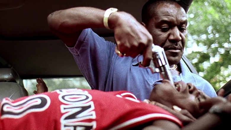 Delroy Lindo like Rodney Little pushes a handgun in the throat of Mekhi Phifer as shot in Clockers