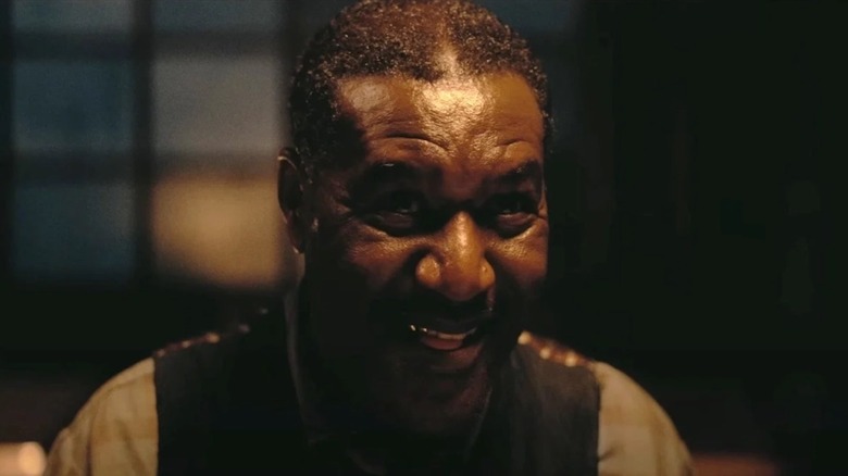 Delroy Lindo flashes a smile at the origin of Delta Slim in sinners