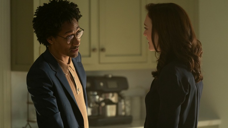 Griffin Matthews as Teddy Lockwood, Charlotte Ritchie as Kate Lockwood face one another for a conversation in Netflix's You
