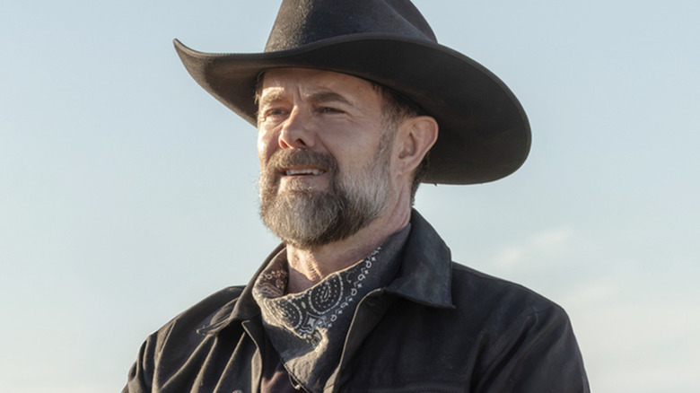 Garret Dillahunt's William Macon is seen in closeup against a blue sky in Lanterns