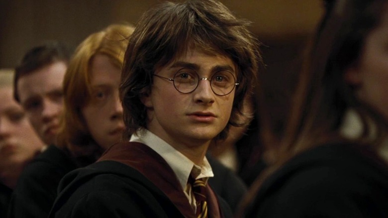 Harry Potter sitting in the dining room in Harry Potter and the Goblet of Fire