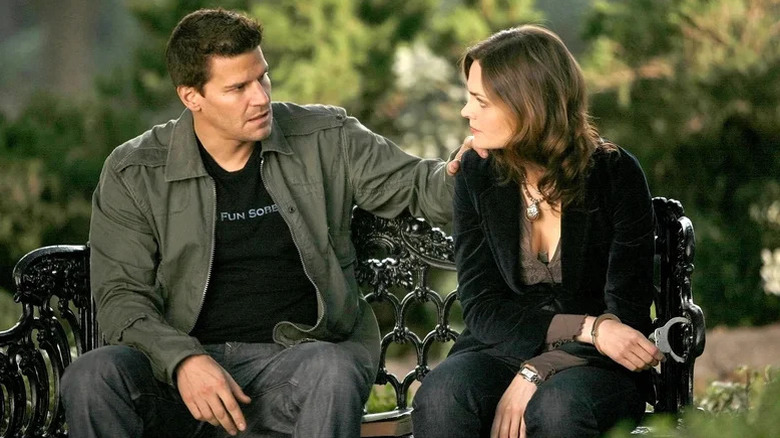 David Boreanaz's Seeley Booth puts a hand on the shoulder of Emily Deschanel's Temperance Brennan in Bones