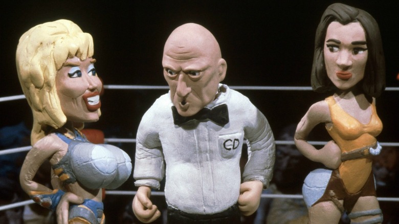 Dolly Parton about to wrestle Lennifer Lopez on Celebrity Deathmatch.
