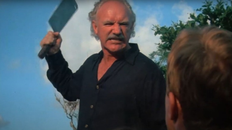 Gene Hackman's Jack McCann brandishes a hatchet in Eureka