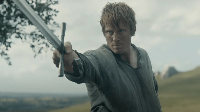 Ser Duncan the Tall raising his sword pretending to be a city watch soldier in A Knight of the Seven Kingdoms