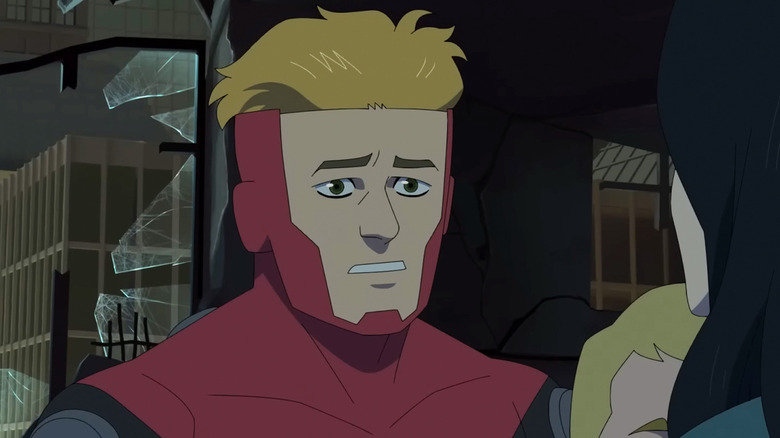 Powerplex looks worried in closeup as he looks at his wife and son in Invincible