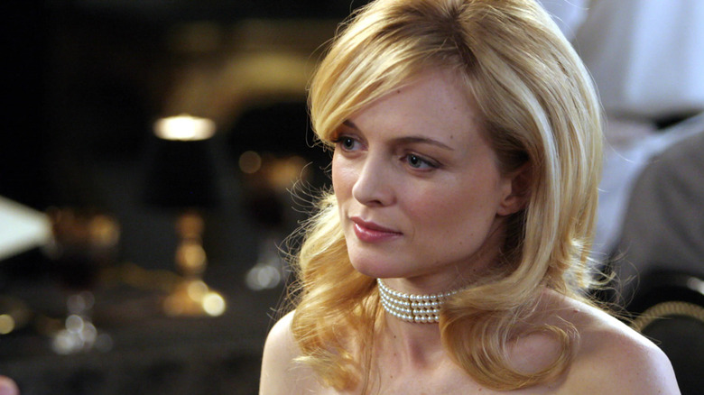 Emily, wearing a pearl choker, wondering what reasons her show might have been canceled in Emily's Reasons Why Not.