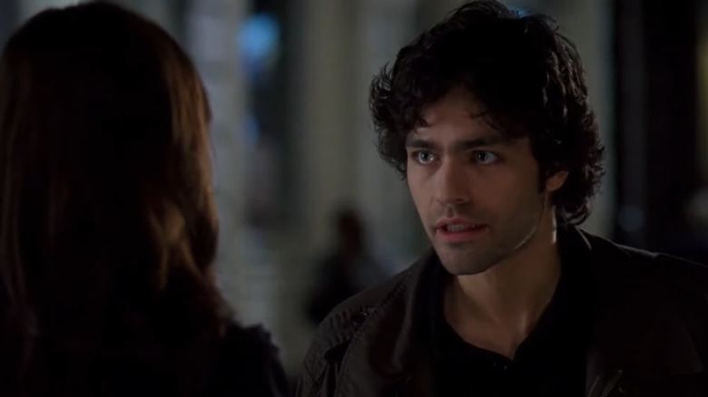 Nate (Adrian Grenier) looks angry at Andy (Anne Hathaway) in The Devil Wears Prada