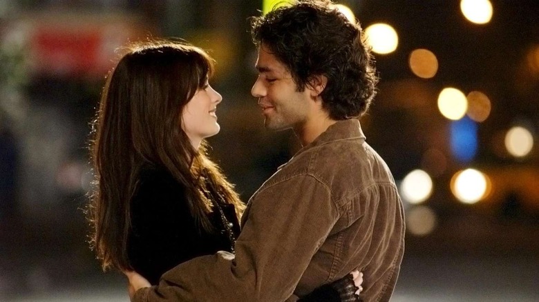 Andy and Nate embracing in The Devil Wears Prada