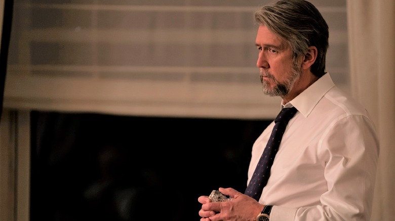 Alan Ruck holding a glass in Succession