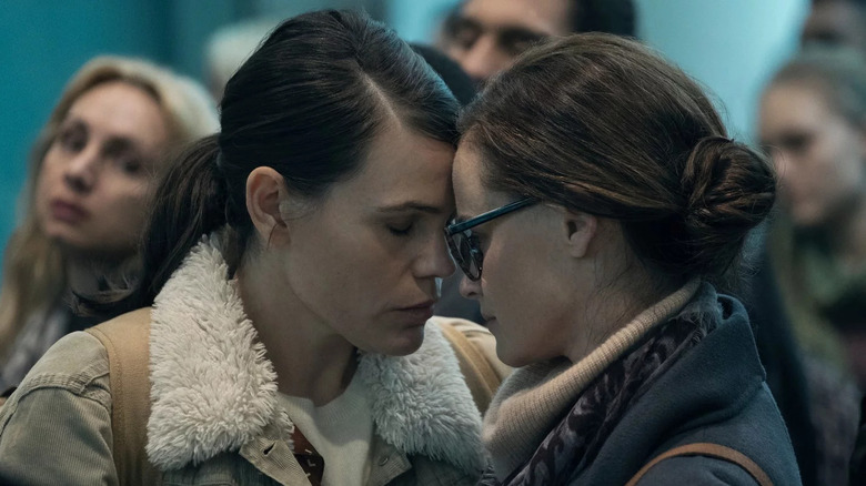 Sylvia and Emily with their heads together on "The Handmaid's Tale"