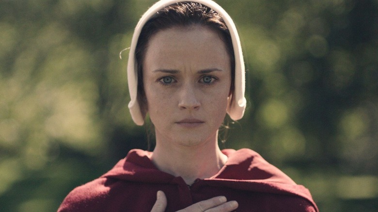 Emily holding her heart in "The Handmaid's Tale"