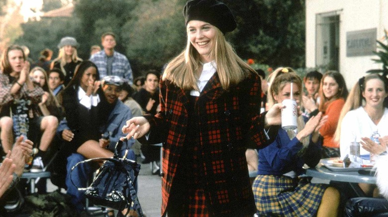 Alicia Silverston in the role of Sher Horwitz, who carries a box of coke in Chloe