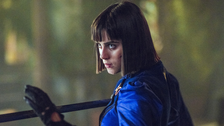 Ally Ioannides as Tilda with a staff in her hand ready to fight in Into the Badlands