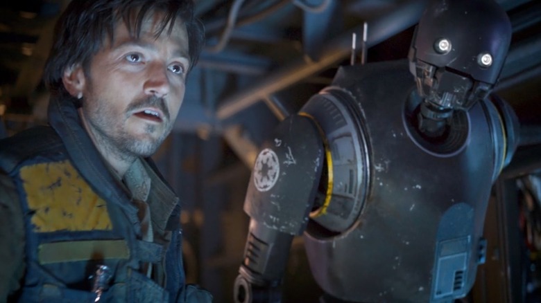 Cassian Andor and K-2SO standing together in Rogue One: A Star Wars Story