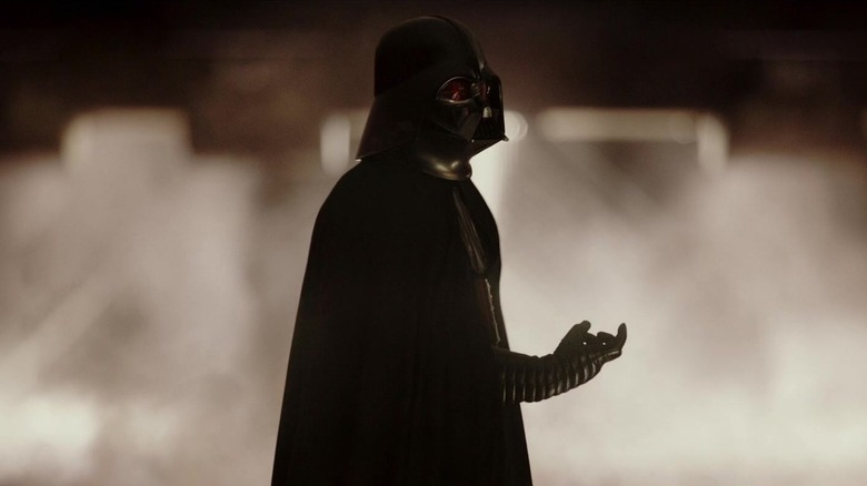 Darth Vader holds out his hand in choking position as he delivers an all-time ziner in Rogue One