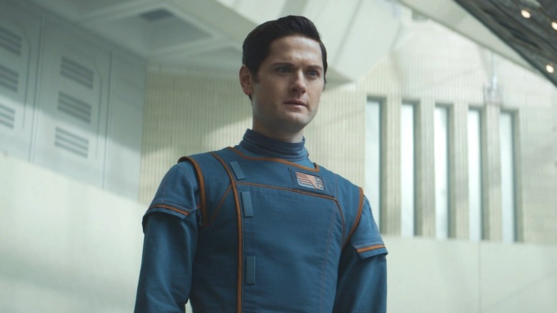 Kyle Soller as Syril Karn looking confused in Andor