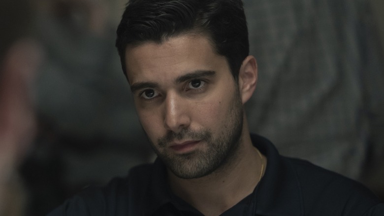 Fabien Frankel as Anthony Grasso sitting down and looking grim in Task