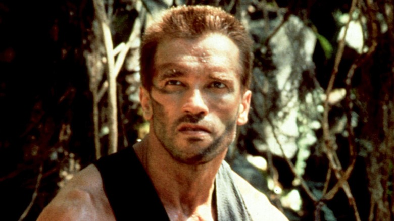 Arnold Schwarzenegger looking up in Predator