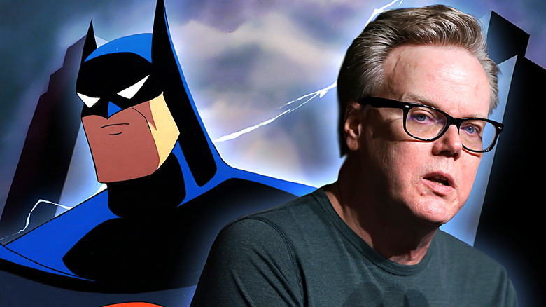 Batman: The Animated Series poster next to series creator Bruce Timm