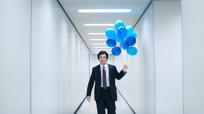 Mark carrying balloons in "Severance"