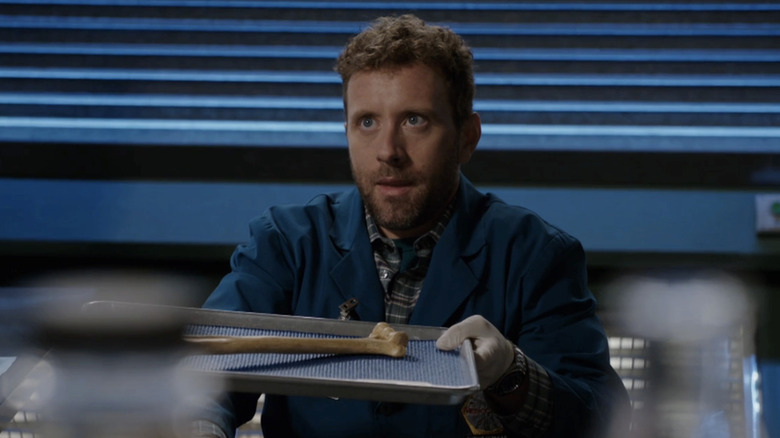 T.J. Thyne as Jack Hodgins holding a bone tray on Bones