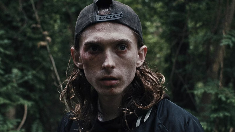 James scans the woods for trouble in Weapons
