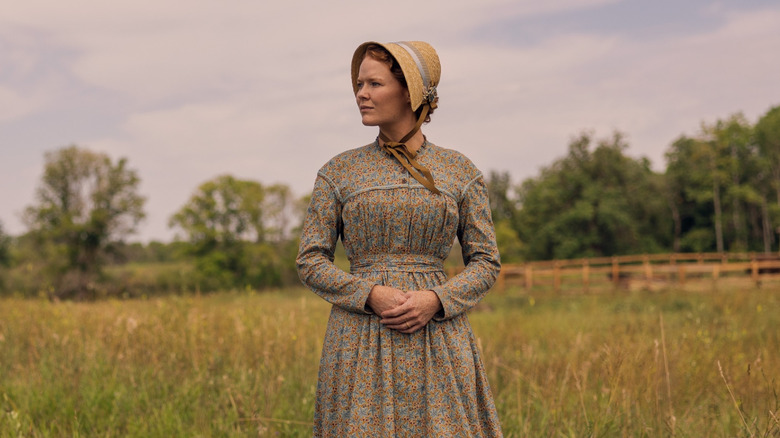 Crosby Fitzgerald as Caroline Ingalls standing in a field in Little House on the Prairie