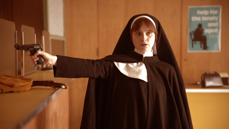 Say Nothing - Dolours Price in nun costume holding gun during bank robbery