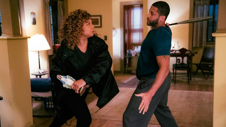 Queen Latifah as Robyn McCall getting ready to hit a man with a religious statue in The Equalizer episode Judgment Day