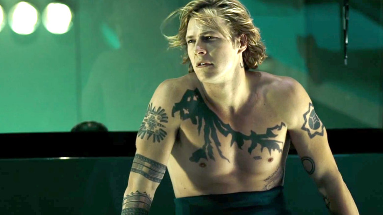 Johnny Utah with no shirt and a lot of tats in Point Break