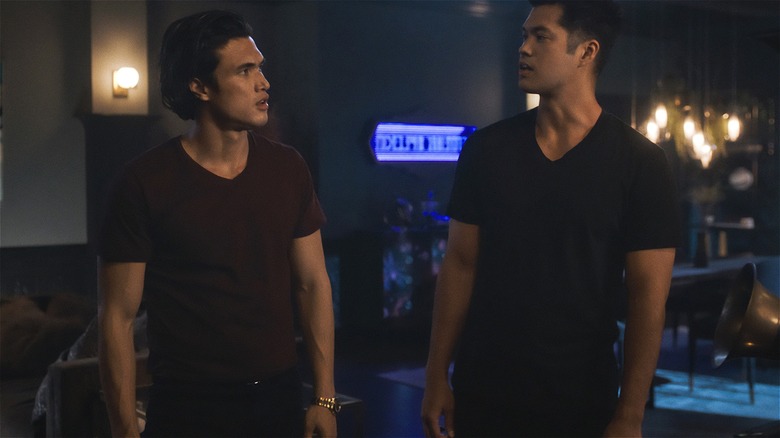 Charles Melton's Reggie and Ross Butler's Reggie staring at each other in Riverdale